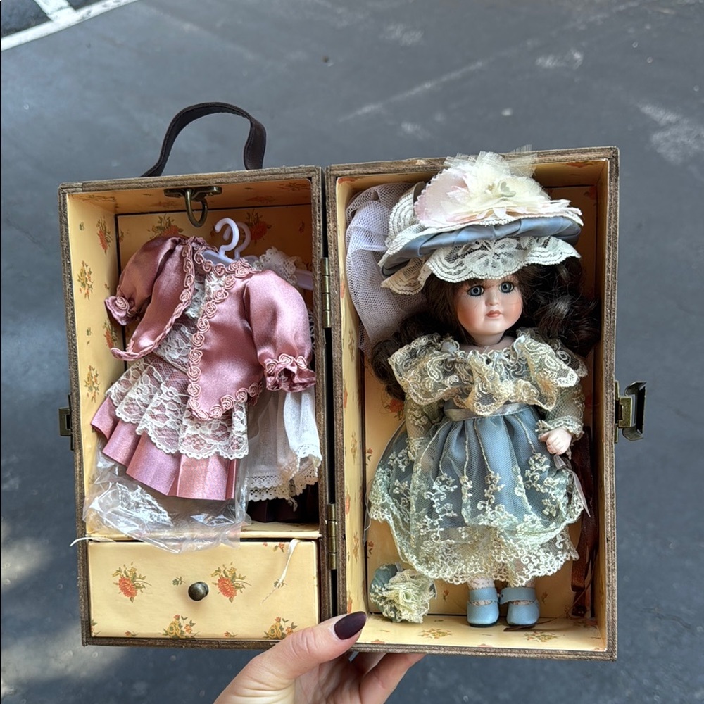 Vintage Style Porcelain Doll with Multiple Outfits